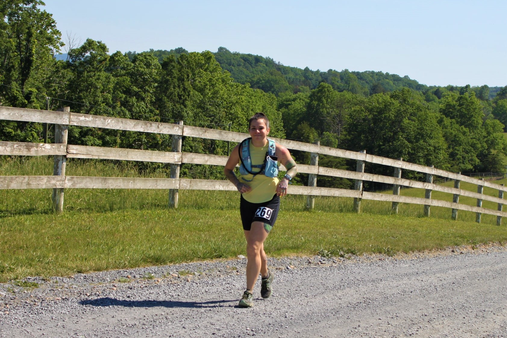 Gina running on a gravel portion of the course.